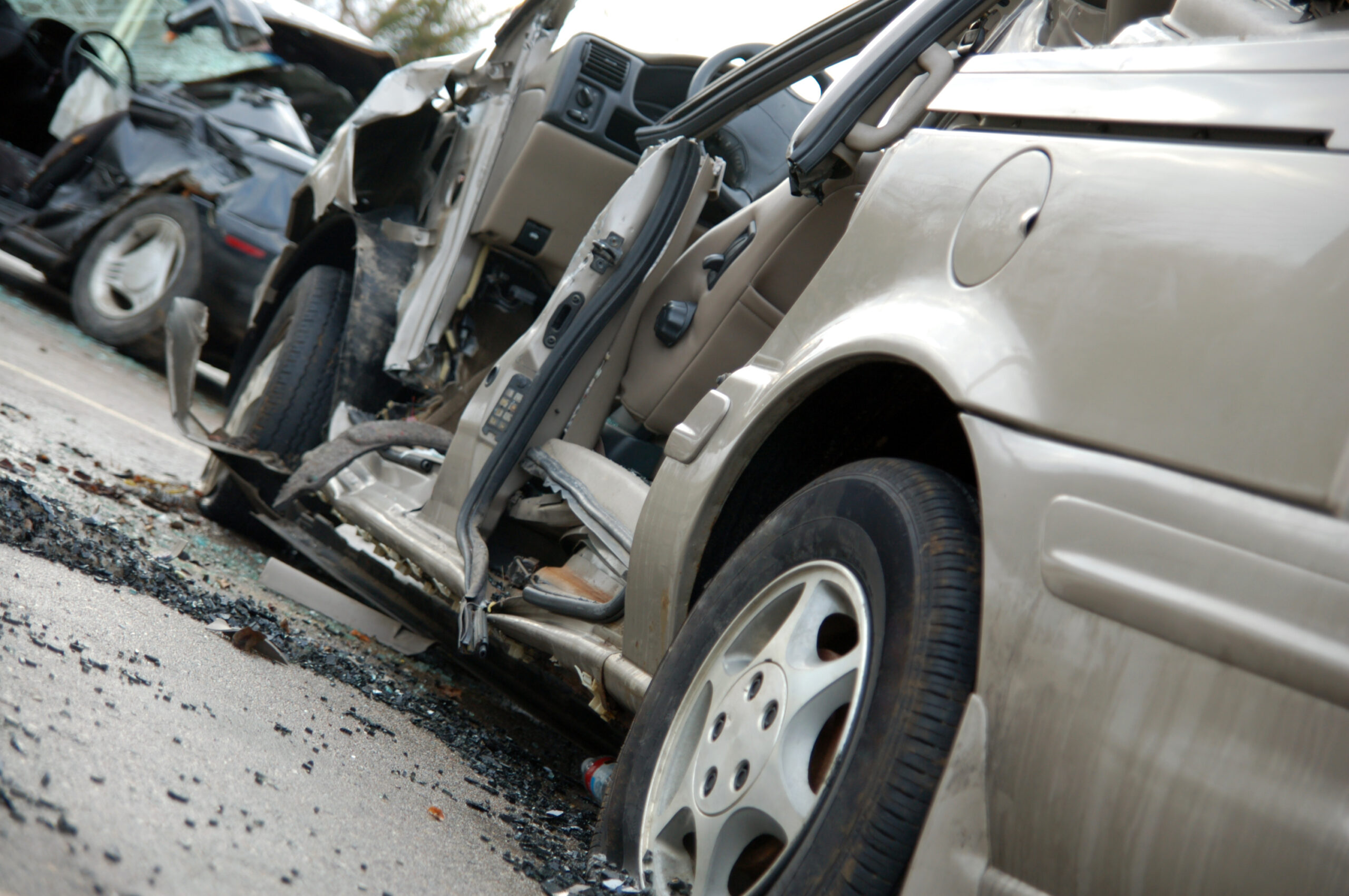 damaged car after an accident with the side torn off