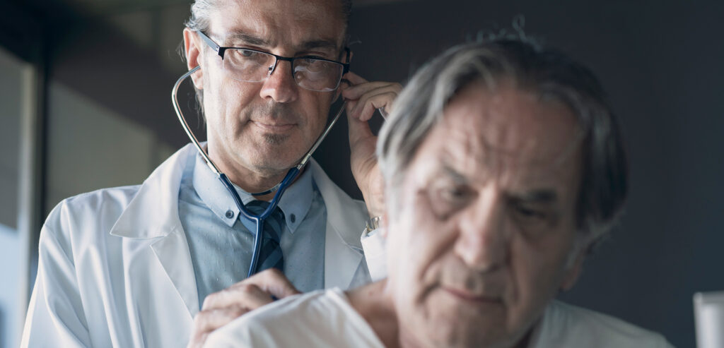 doctor listening to patients lungs asbestos related disease