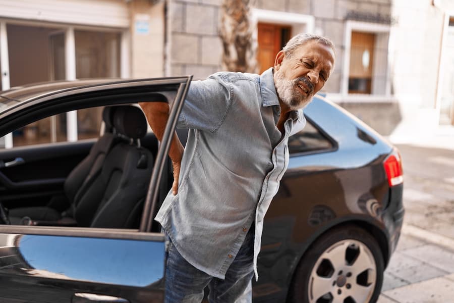 man suffering back pain