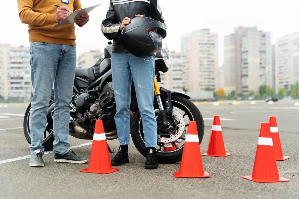 Teacher giving tips to newbie motorcycle rider